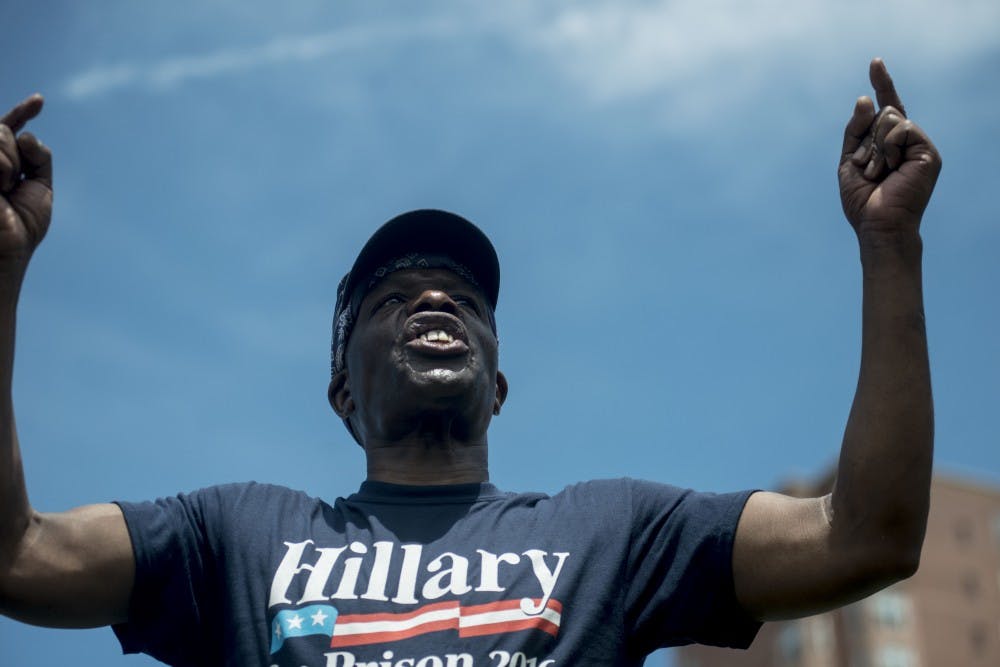 Long Island, NY resident Kennith Lane chants during a "Make America Safe Again" rally on July 18, 2016 at Settlers Landing Park in Cleveland, Ohio. 