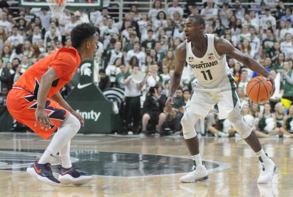 <p>Senior guard Lourawls Nairn Jr. (11) goes against Illinois' guard Trent Frazier (1) during the first half of the men's basketball game against Illinois on Feb. 20, 2018 at Breslin Center. The Spartan's led the first half, 38-35. (Annie Barker | The State News)</p>