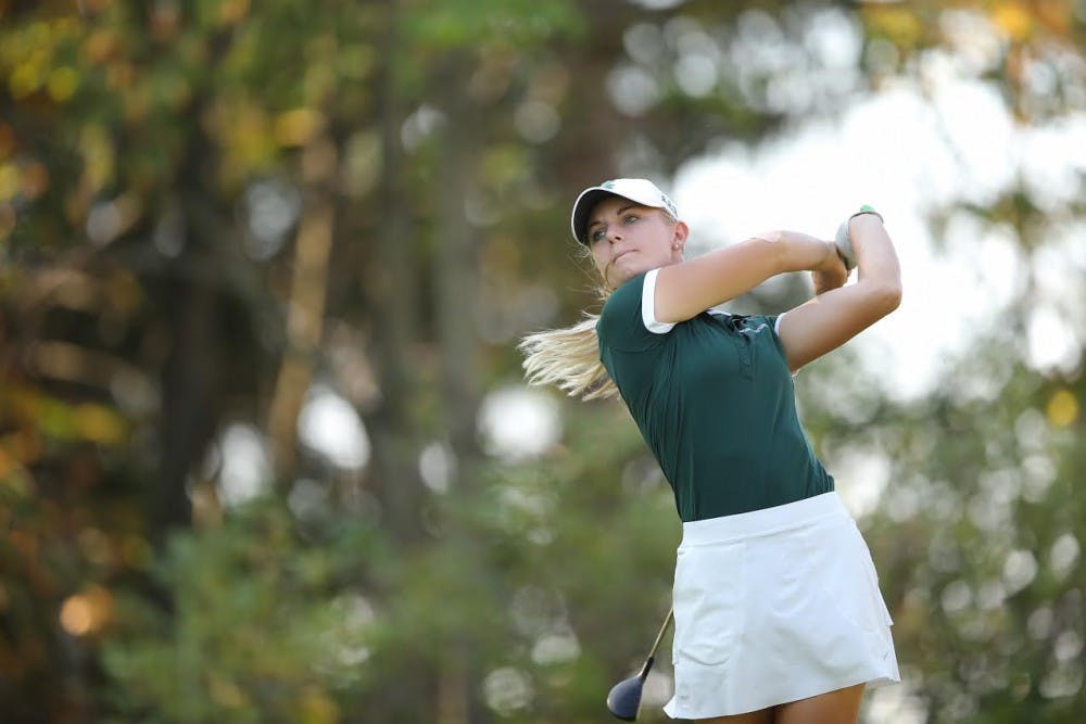 <p>Senior Sarah Burnham looks at her shot at the Mary Fossum Invitational in East Lansing in fall 2017. (Photo courtesy: MSU Athletic Communications)</p>