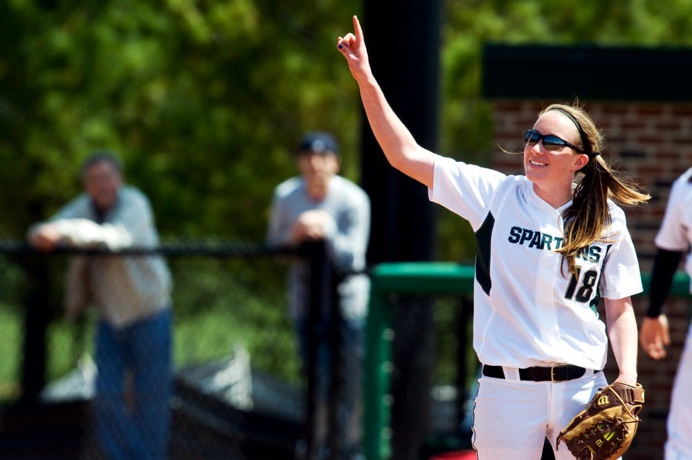 	<p>Freshman pitcher Cassee Layne gestures to her team between pitches Saturday afternoon at Secchia Stadium. The Spartans lost Saturday&#8217;s game to Indiana, 7-2. Matt Hallowell/The State News</p>