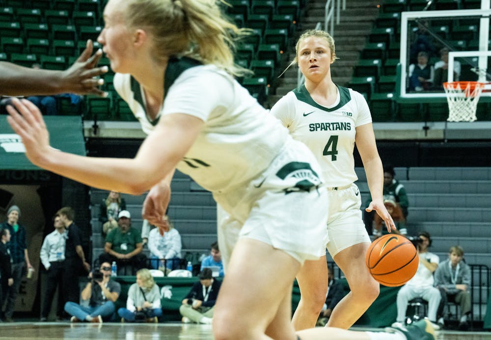 <p>Freshman guard Theryn Hallock (4) dribbles the ball at the game against Oakland at the Breslin Center on Nov. 15, 2022. The Spartans defeated the Grizzlies 85-39. </p>