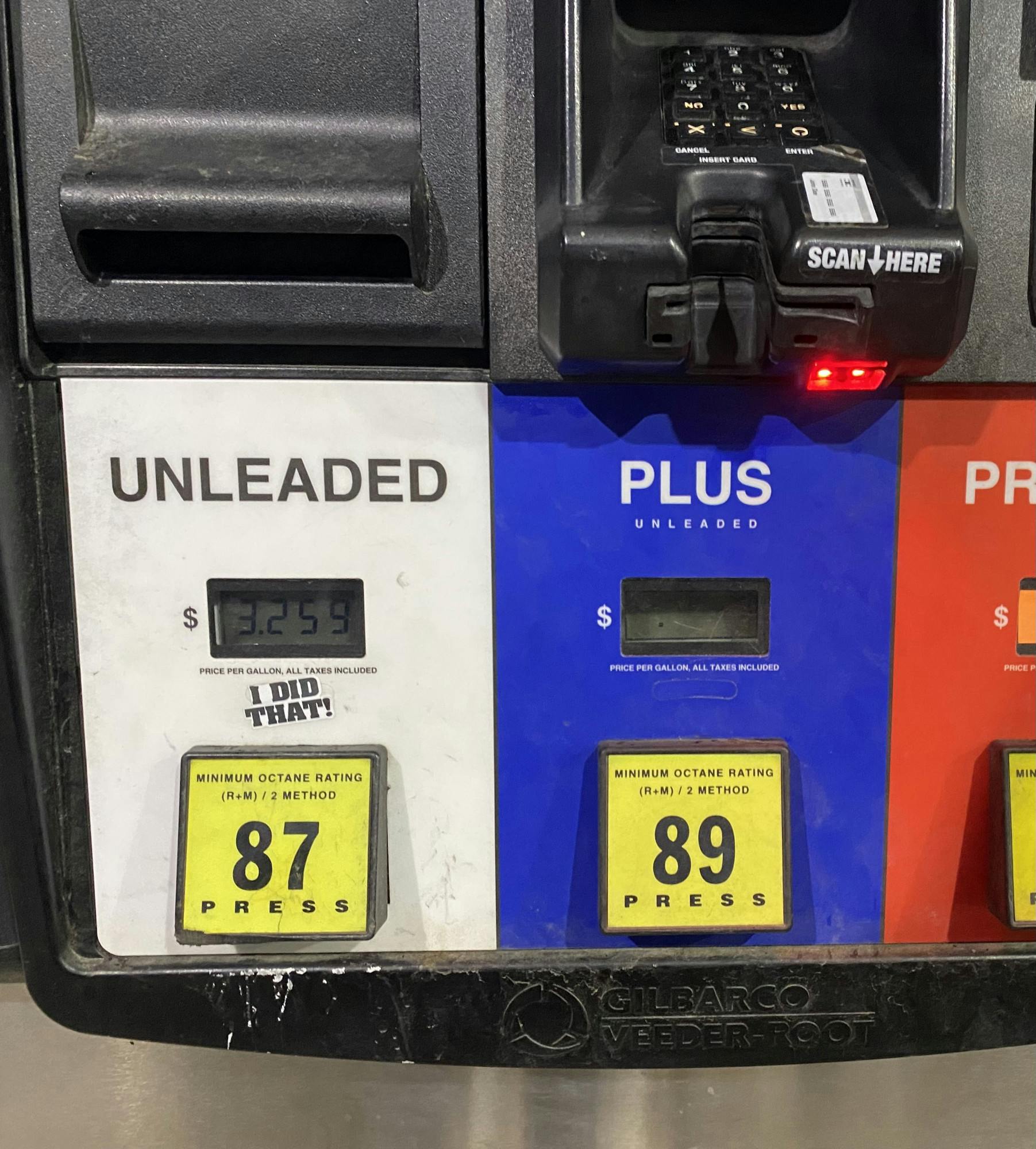 A pump at a gas station in Lansing, Michigan is worn down with a half-ripped sticker, "I did that"– the other half missing a photo of President Biden, a sticker that has appeared at multiple gas stations in the area. Nov. 18, 2021. 