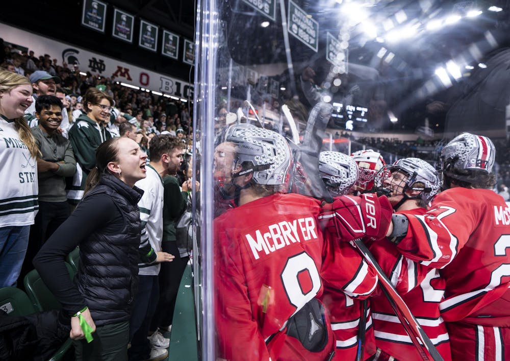 <p>Spartan fans yell at the OSU players after they defeated MSU 3-2 during overtime in the Munn Ice Arena on March 14, 2026.</p>