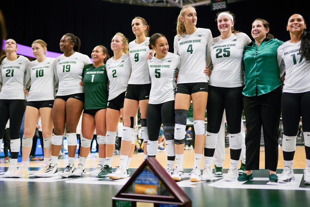 <p>The Spartans celebrate winning their match against the University of Michigan at the Breslin Student Events Center on Oct. 18, 2023. MSU secured a 3-1 victory and claimed the "State Pride Flag," an award given to the winner of the MSU vs. U of M volleyball rivalry.</p>