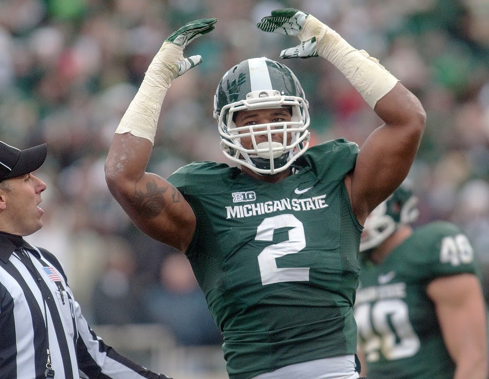 <p>Junior defensive end William Gholston pumps up the crowd Nov. 3, 2012, at Spartan Stadium. Gholston was a member of the Superbowl LV winning Tampa Bay Buccaneers, who defeated the Kansas City Chiefs on Feb. 7, 31-9 to become the first team to pay in and win a Superbowl at their home stadium. (Adam Toolin/The State News)</p>