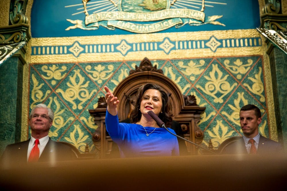 Gov. of Michigan Gretchen Whitmer gestures into the audience during the State of the State address on Feb. 12, 2019 at the Capitol in Lansing.