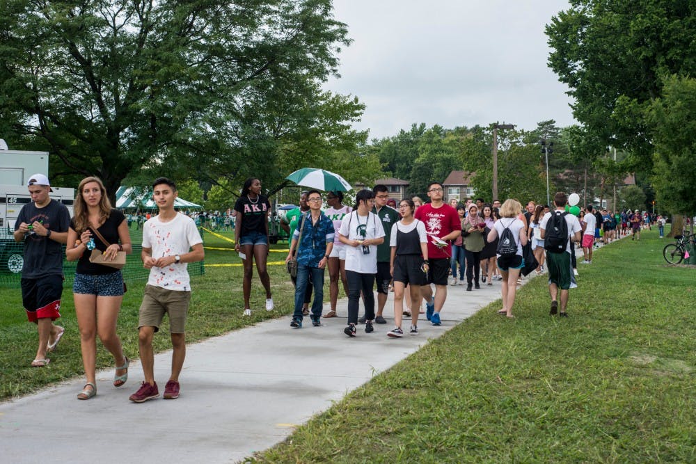 Students attending Sparticipation walk away from Cherry Lane Field on Aug. 30, 2016. Sparticipation is an annual event that provides student organizations a space to promote their organization to thousands of students. Sparticipation was cancelled rescheduled to a different date due to severe weather.