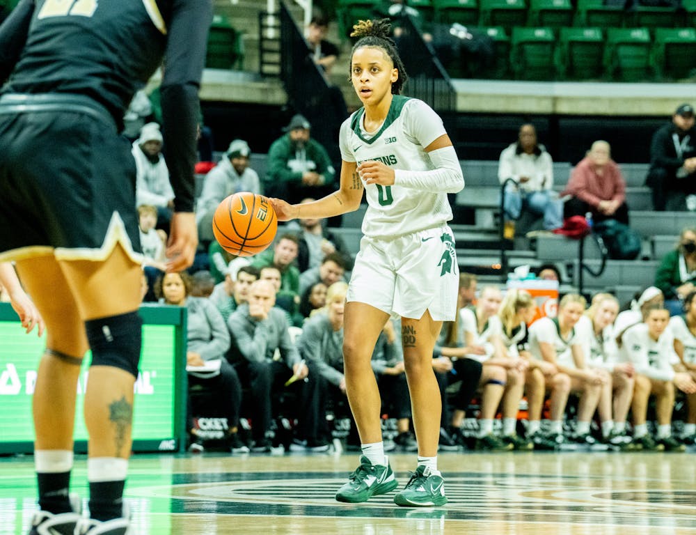 <p>Sophomore guard DeeDee Hagemann (0) dribbles the ball at the game against Oakland at the Breslin Center on Nov. 15, 2022. The Spartans defeated the Grizzlies 85-39. ﻿</p>
