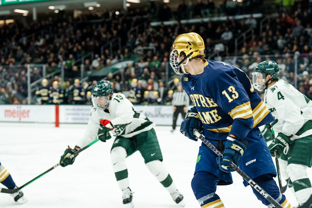 <p>Notre Dame graduate forward Chayse Primeau (13) turns to chase the Spartans for the puck (3-2) on Feb. 4, 2023.</p>