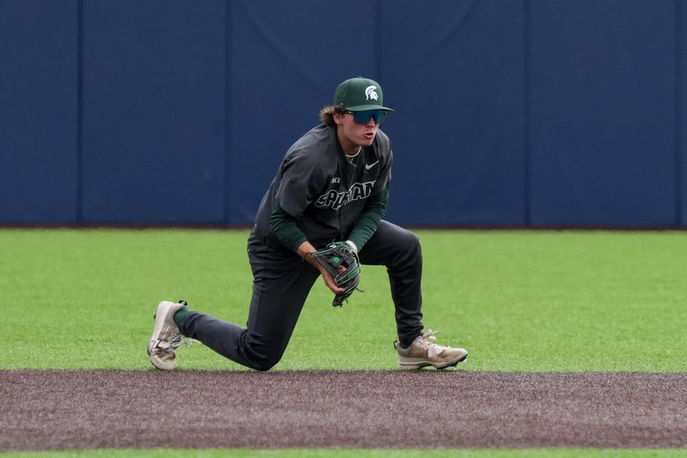 Michigan State freshman Dayton Murphy (3) fields the ball diving on April 26, 2025. The Spartans lost to the Wolverines in the second game 9-2.