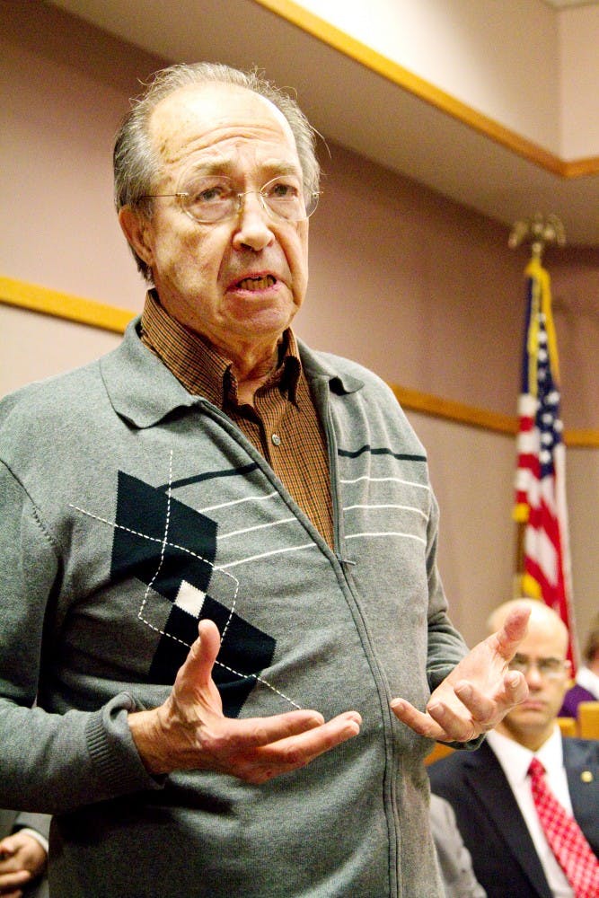 Former East Lansing Mayor George Griffiths speaks about the history of East Lansing's anti-sexual discrimination measures Tuesday at City Hall. The East Lansing City Council celebrated the 40th anniversary of East Lansing's first-in-the-nation ban on discrimination based on sexual orientation. Derek Berggren/The State News