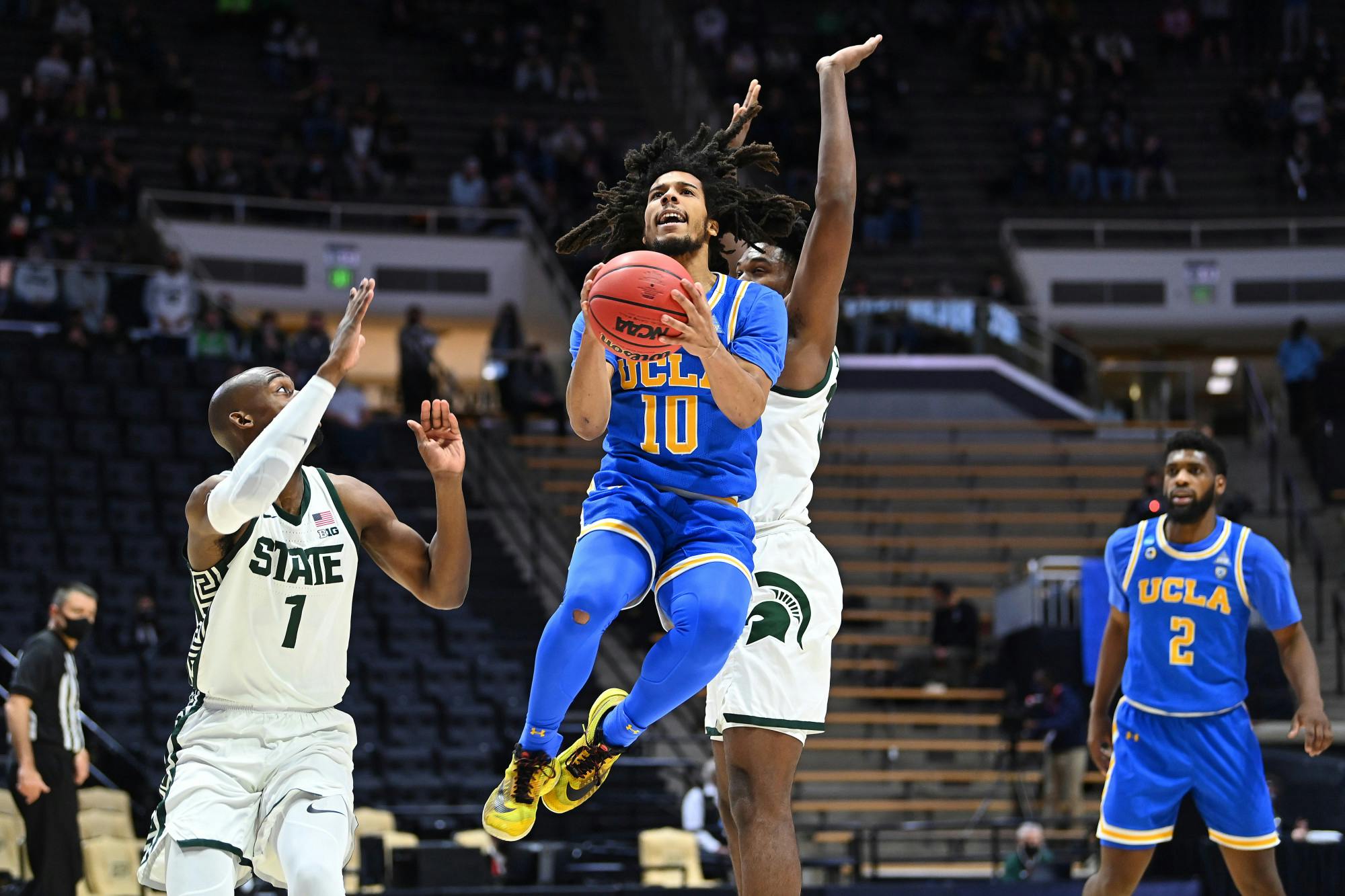 WEST LAFAYETTE, IN - MARCH 18: Tyger Campbell #10 of the UCLA Bruins drives to the basket against the Michigan State Spartans in the First Four round of the 2021 NCAA Division I Men’s Basketball Tournament held at Mackey Arena on March 18, 2021 in West Lafayette, Indiana. (Credit: Andy Hancock/NCAA Photos via Getty Images)