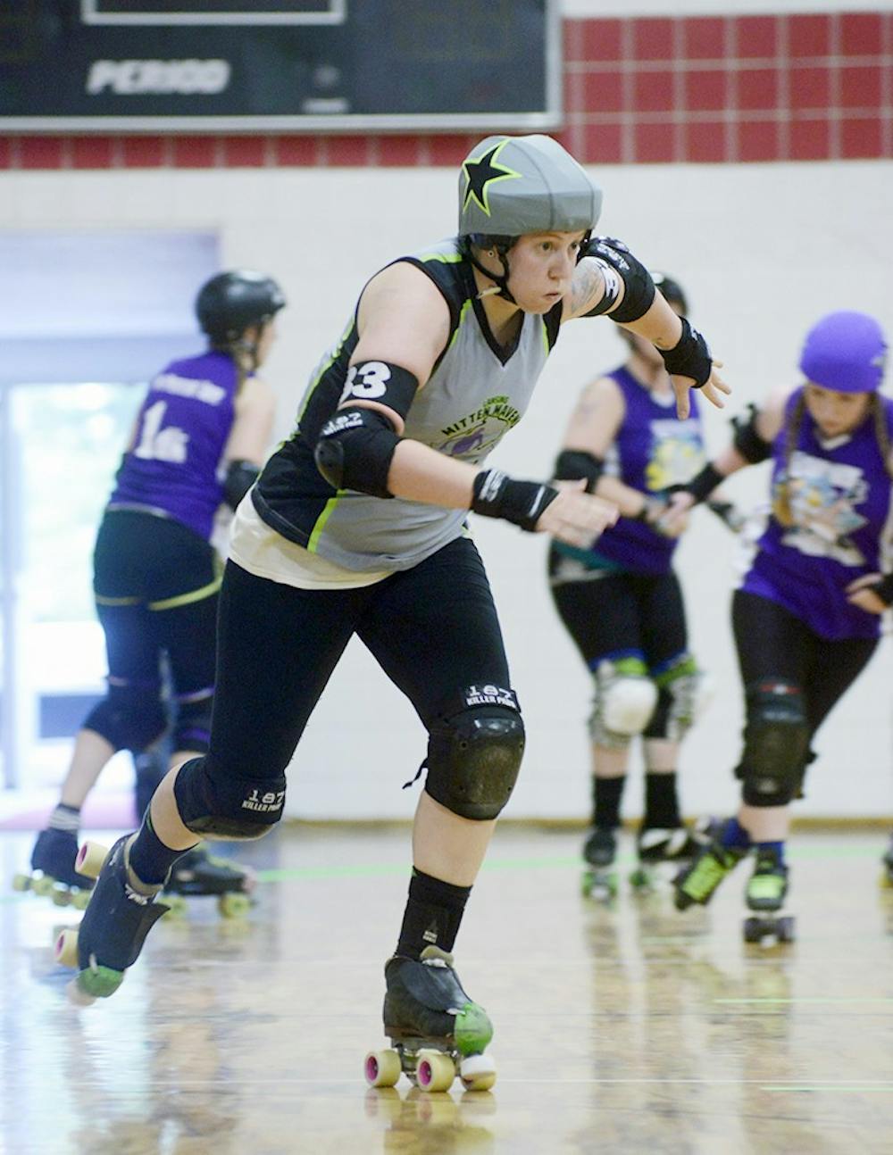 <p>Samantha Perez, who goes by "El Gingero"for the Lansing Mitten Mavens Roller Derby team, gets out in front of the defense during their match against the Bath City Roller Girls on June 20th, 2015 at Court One Training Center in East Lansing. Wyatt Giangrande/The State News</p>