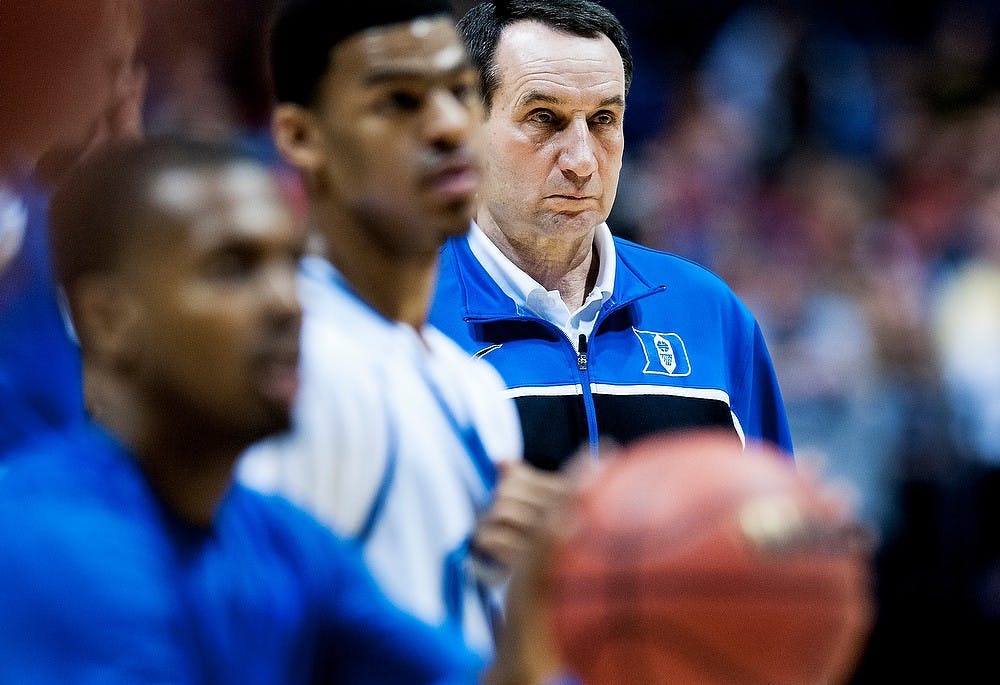	<p>Duke head coach Mike Krzyzewski watches as players shoot during  an open practice Thursday, March. 28, 2013, at Lucas Oil Stadium in<br />
Indianapolis, Ind. The Spartans will play the Duke Blue Devils in the<br />
<span class="caps">NCAA</span> Tournament Sweet 16 at 9:45 p.m. Friday. Adam Toolin/The State News</p>