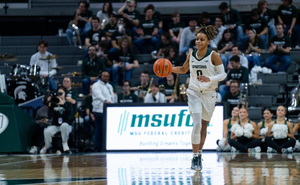 Junior guard DeeDee Hagemann (0) dribbles down the court during a game against Northwestern at the Breslin Center on Jan. 17, 2024.  The Spartans took home a win against the Wildcats with a score of 91-72.