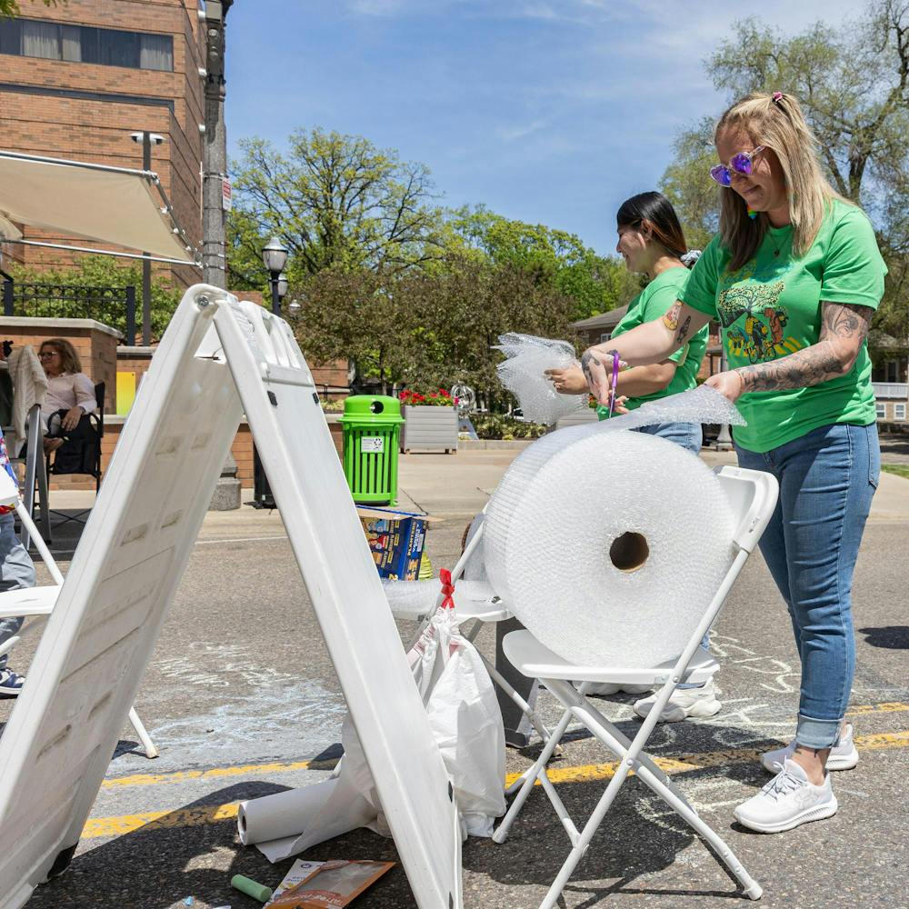 <p>East Lansing Art Festival staff hand out pieces of bubble wrap to attendees to pop while walking around the booths in East Lansing, Mich., on May 16, 2026.</p>