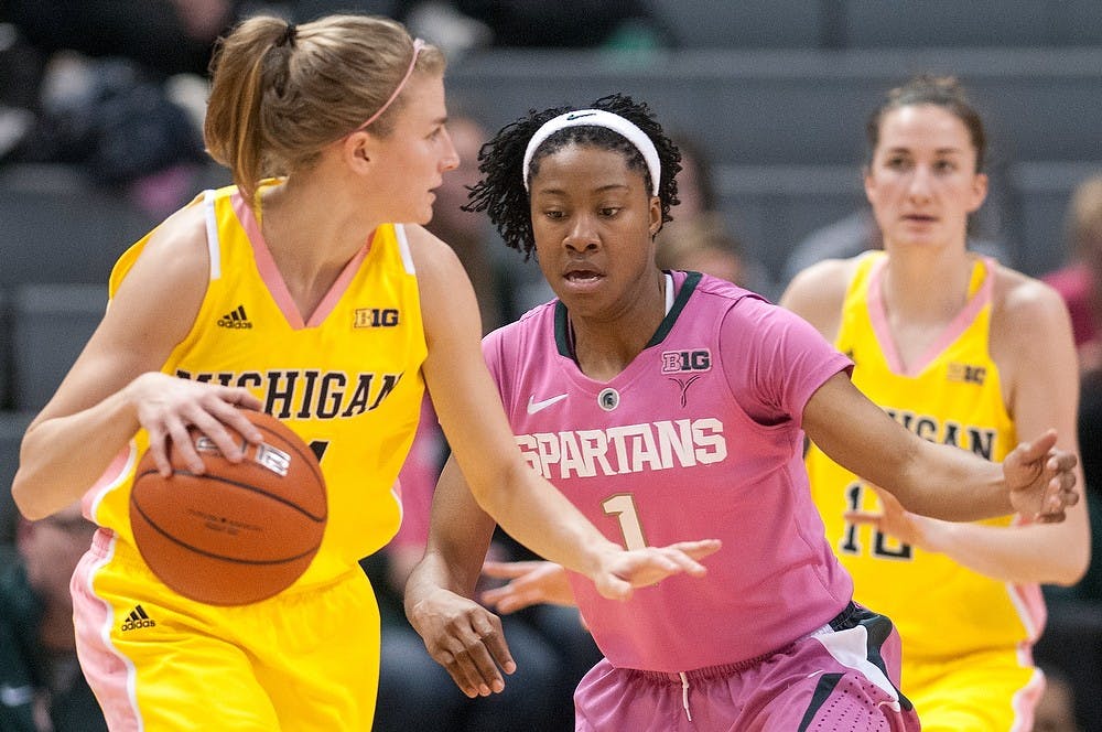 	<p>Senior guard Jasmine Thomas defends U-M guard Jenny Ryan over at the far side of the court. The Spartans defeated the Wolverines, 61-46, Monday, Feb. 4, 2013, at Breslin Center. Justin Wan/The State News</p>