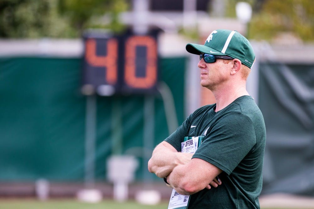 <p>Shayne Graham watches practice on Aug. 2, 2018 at Duffy Daugherty Football Building.</p>