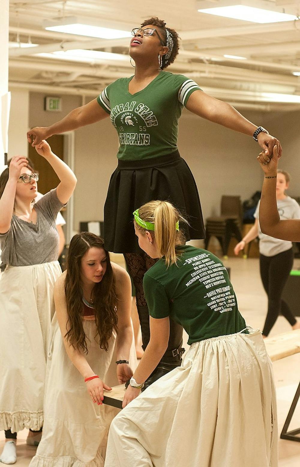 <p>Theatre and interdisciplinary social science senior Jenise Cook rehearses a song Mar. 17, 2015, at the Auditorium, 542 Auditorium Rd. "Hair" will be performed in the Wharton Center April 17-26. Alice Kole/The State News </p>