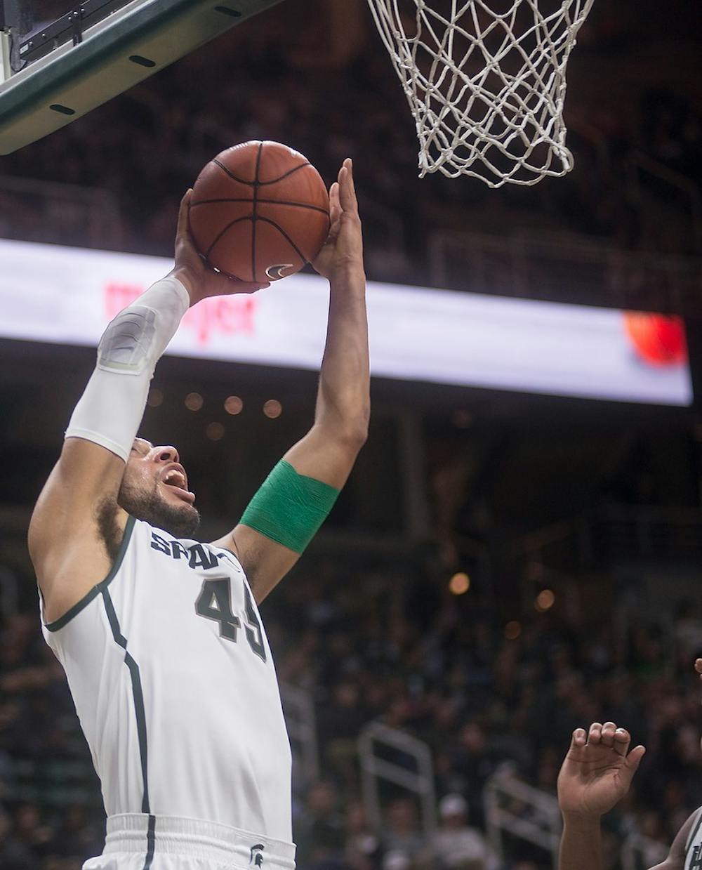 <p>Junior guard Denzel Valentine goes for a point Nov. 24, 2014, during the game against Santa Clara at Breslin Center. The Spartans defeated the Broncos, 79-52. Erin Hampton/The State News</p>