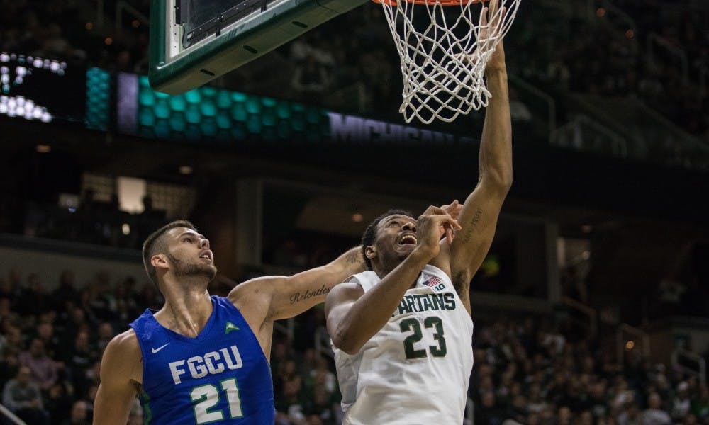 Sophomore forward Xavier Tillman (23) makes a basket during the game against Florida Gulf Coast University at Breslin Center on Nov. 11, 2018. The Spartans defeated the Eagles, 106-82.
