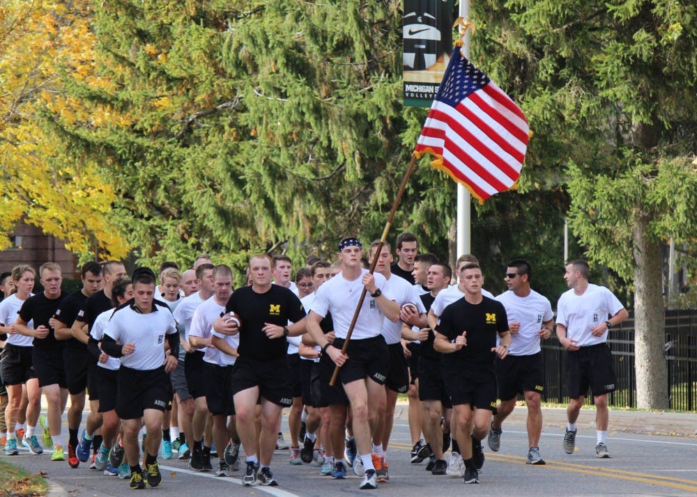 <p>ROTC cadets run in Alex's Great State Race from U-M to MSU in 2016. Photo courtesy of MSU Resource Center for Person with Disabilities Facebook page.&nbsp;</p>