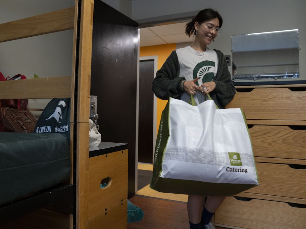 Sophomore Mia Burghardt moves into her new dorm in Bailey Hall during Fall 2022 Move-In on Friday, Aug. 26, 2022 at Michigan State University. “Coming in for my second year, I’m less anxious and more excited,” she said. 