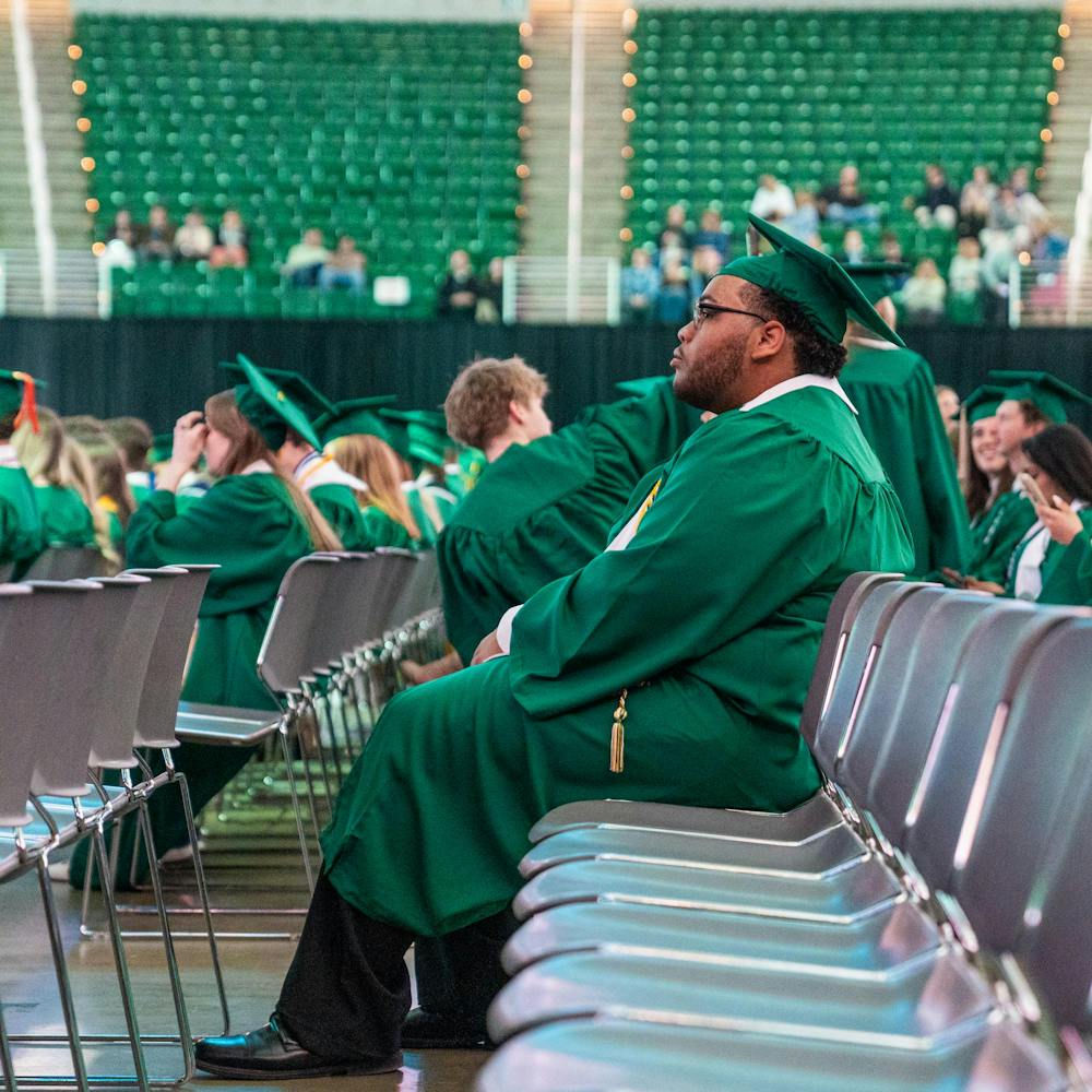 <p>A graduating Michigan State student sits in a chair on the Breslin Center floor waiting for a convocation to start in East Lansing, Mich., on May 1, 2026.</p>