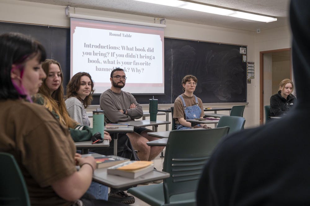 Students listen to discussion during Sigma Tau Delta's Banned Book Night at Wells Hall on April 21, 2025.