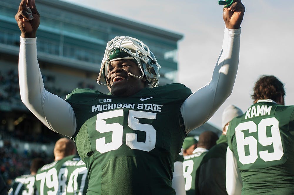 	<p>Freshman defensive tackle Devyn Salmon celebrates at the end of the game against Minnesota on Nov. 30, 2013, at Spartan Stadium. The Spartans defeated the Golden Gophers, 14-3. Danyelle Morrow/The State News</p>