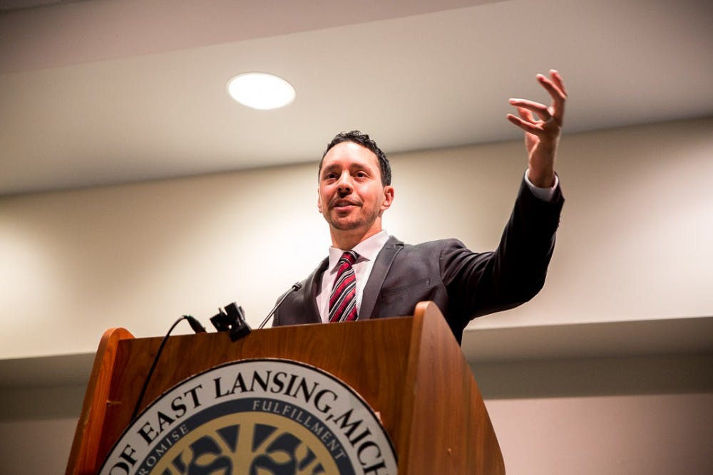 Associate professor of religious studies Mohammad Hassan Khalil speaks during the "Face to Face: A Conversation About Bans, Walls and Mass Shootings” panel on March 27, 2019 at the East Lansing Hannah Community Center.