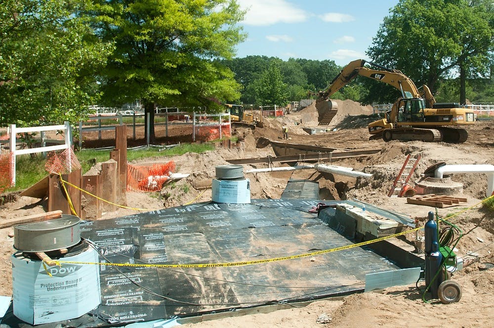 	<p>Construction continues on June 18, 2013, at the intersection of Bogue Street and East Shaw Lane. Weston Brooks/The State News </p>