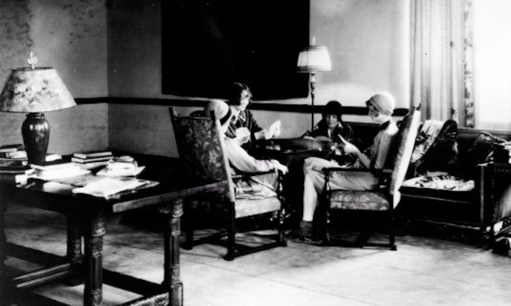 Students from the the university, which then was known as Michigan State College of Agriculture and Applied Science, play a card game in a lounge in Mayo Hall in the 1930s. Mary Mayo, the hall's namesake, is rumored to haunt this building. Photo courtesy of MSU Archives & Historical Collection.