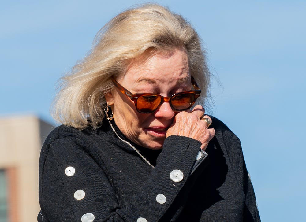 <p>Former trustee Melanie Foster is overcome with emotion at The Rock on Farm Lane on Feb. 14, 2023 one day after the mass shooting in Michigan State University's North Neighborhood.</p>