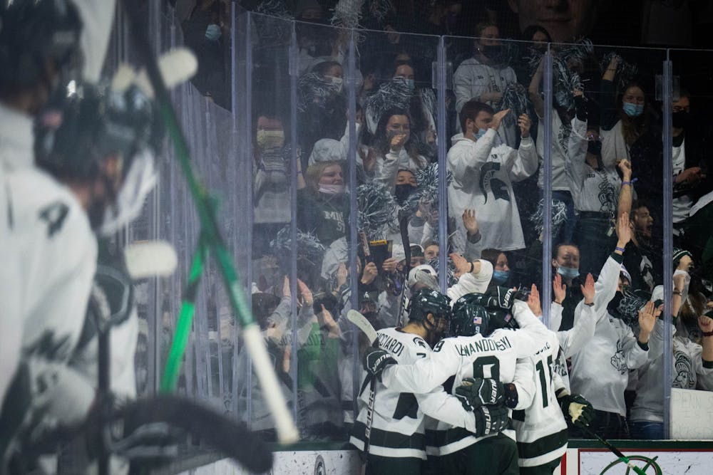 <p>MSU men’s hockey celebrates after Spartans score during the first period against Penn State at Munn Ice Arena on Feb. 25, 2022. The Spartans fell to the Nittany Lions with a score of 5-3.</p>
