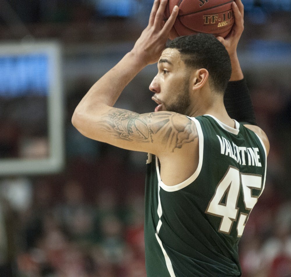 <p>Junior guard Denzel Valentine holds the ball as he waits for a play to be set Mar. 14, 2015, during the game against Maryland at the Big Ten Tournament at United Center in Chicago. The Spartans defeated the Terrapins, 62-58. Kelsey Feldpausch/The State News</p>