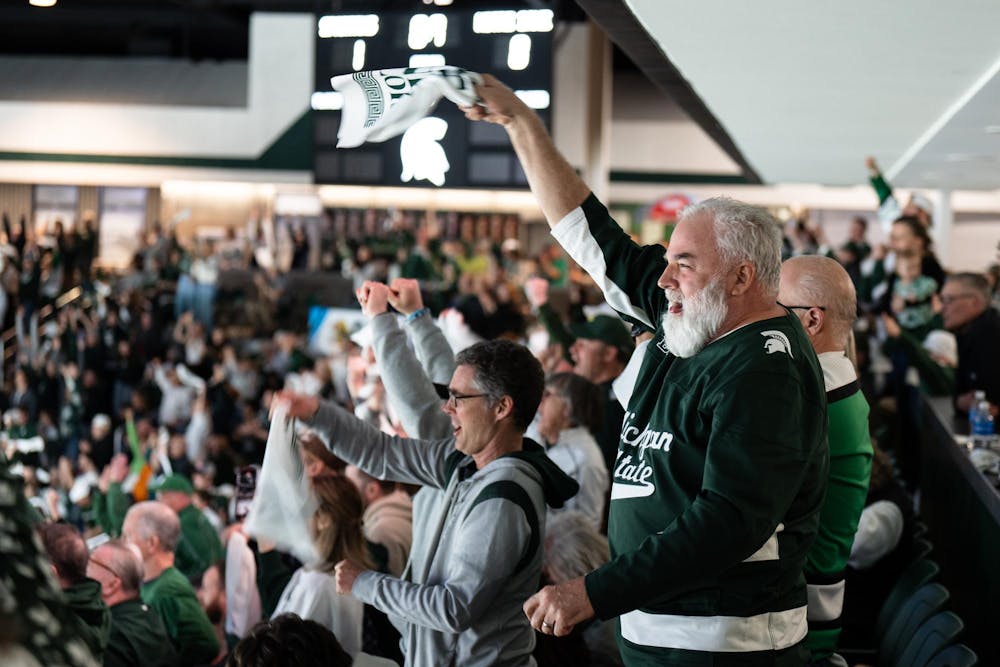 Spartans cheer and sing the MSU fight song after a win against Notre Dame at Munn Ice Arena on March 15, 2025. The Spartans took a 1-0 victory over the Fighting Irish, advancing to the Big Ten Championship.