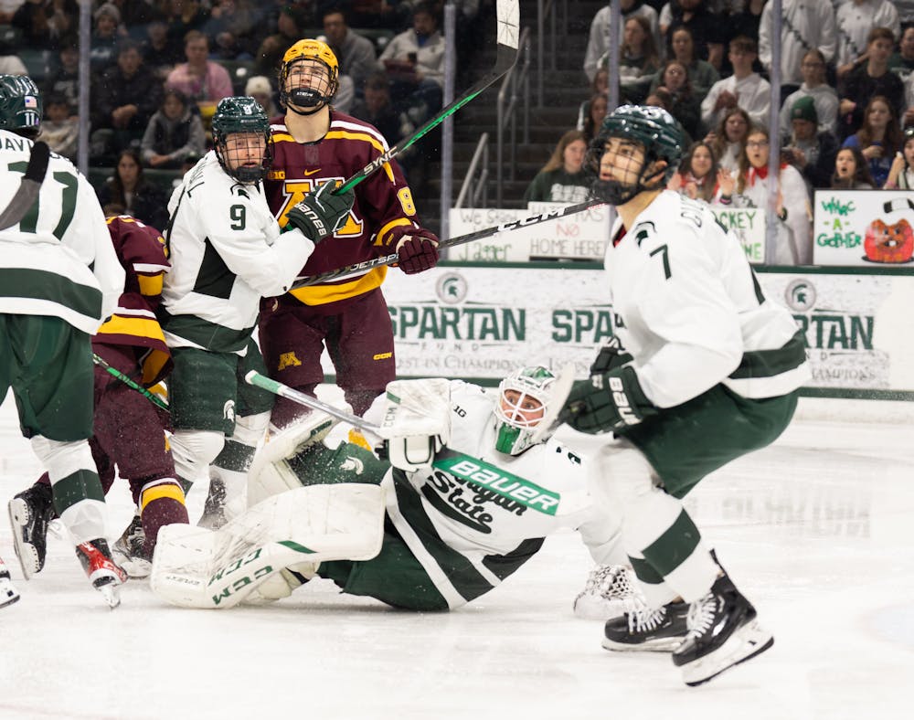 MSU players watch for the puck after a close call at the Spartans net during a game against University of Minnesota at Munn Ice Arena on Dec. 2, 2022. The Spartans lost to the Gophers with score 5-0. 