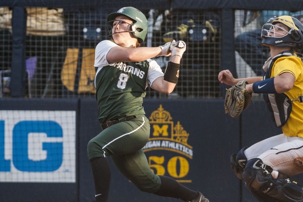 <p>Sophomore utility player Kaitlyn Eveland (8) swings the bat during the game against University of Michigan on April 18, 2017 Wilpon Baseball and Softball Complex in Ann Arbor. The Spartans were defeated by the Wolverines, 3-1.</p>