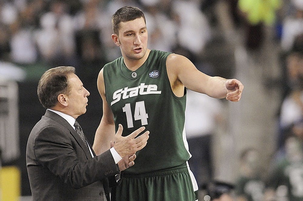 <p>Then-senior center Goran Suton speaks with coach Tom Izzo during the first half of the 2009 NCAA men&#x27;s championship basketball game held at Ford Field in Detroit on April 6, 2009. State News File Photo</p>