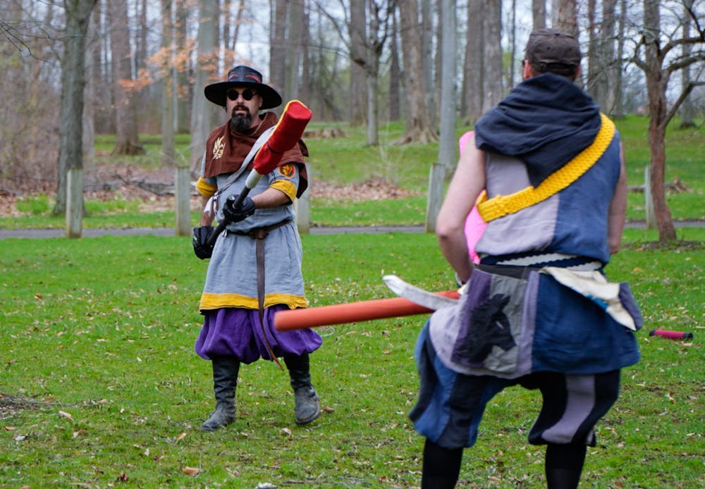 Current Champion of Ashen Hills Michael O'Meara (Master Dong) appears to try and attack Jeff Droulliard (Sicarius) at Ashen Hills LARP in Patriache Park, on May 1, 2022.