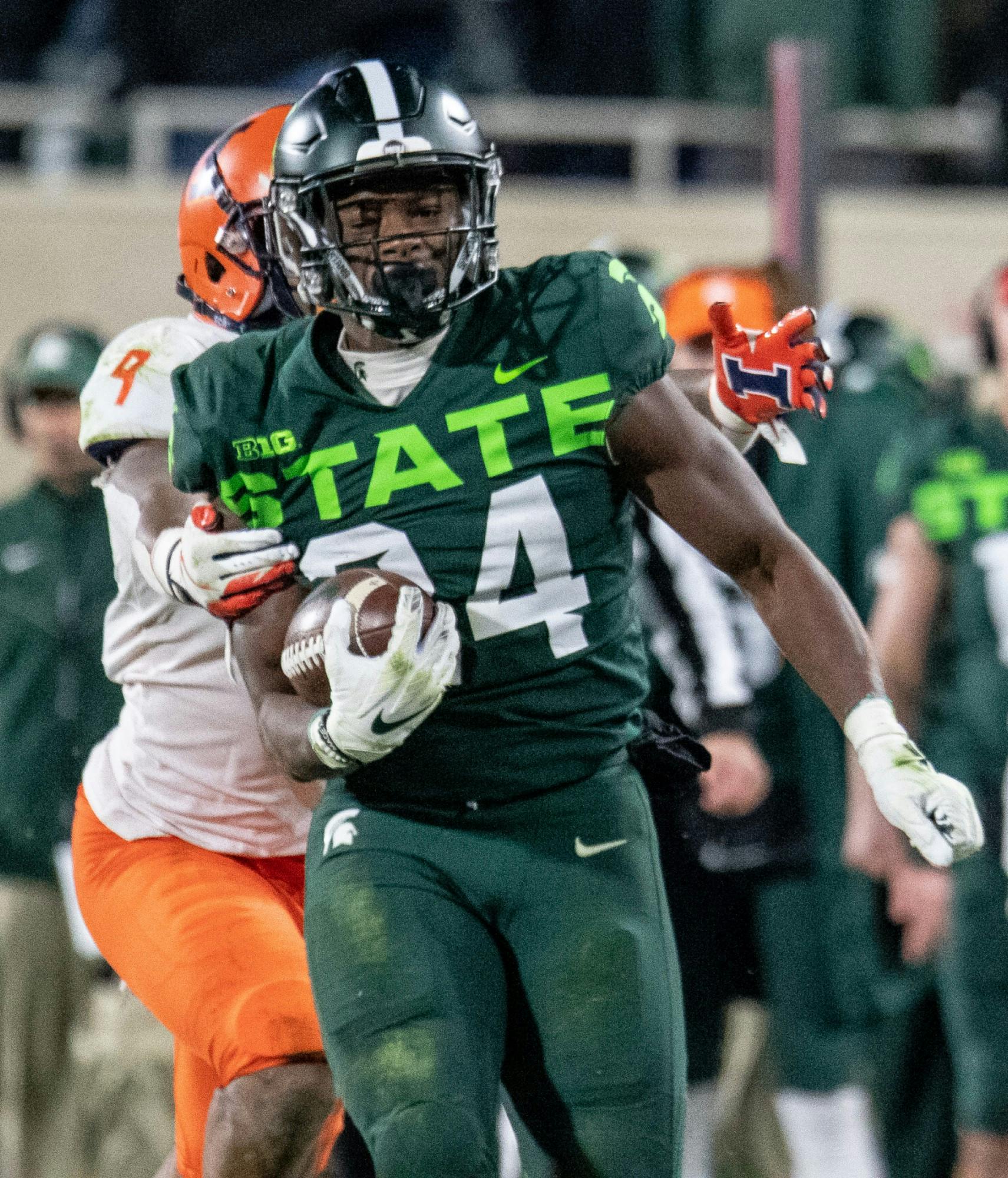<p>Redshirt freshman Elijah Collins (24) is brought down on a long run during the game against Illinois on Nov. 9, 2019, at Spartan Stadium. The Spartans fell to the Fighting Illini, 37-34.</p>