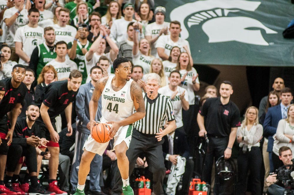 Sophomore forward Nick Ward (44) looks for a pass in the last few seconds of overtime during the game against Rutgers on Jan. 10, 2018 at Breslin Center. The Spartans narrowly beat the Scarlet Knights 76-72 .