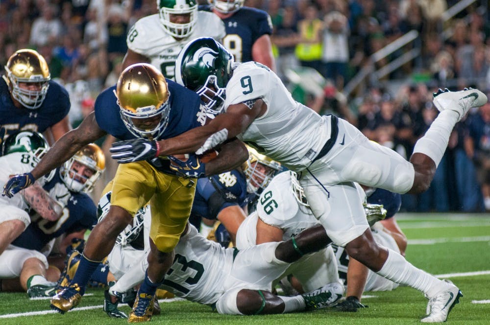 Junior safety Montae Nicholson (9) tackles Notre Dame wide receiver Tarean Folston (25) during the game against Notre Dame on Sept. 17, 2016 at Notre Dame Stadium in South Bend, Ind. The Spartans defeated the Fighting Irish, 36-28.