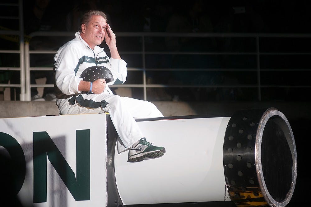 	<p>Men&#8217;s basketball head coach Tom Izzo enters the Breslin Center on top of a cannon Oct. 18, 2013, during Midnight Madness. The crowd was lead to believe that it was Izzo that was shot out of the cannon. Julia Nagy/The State News</p>