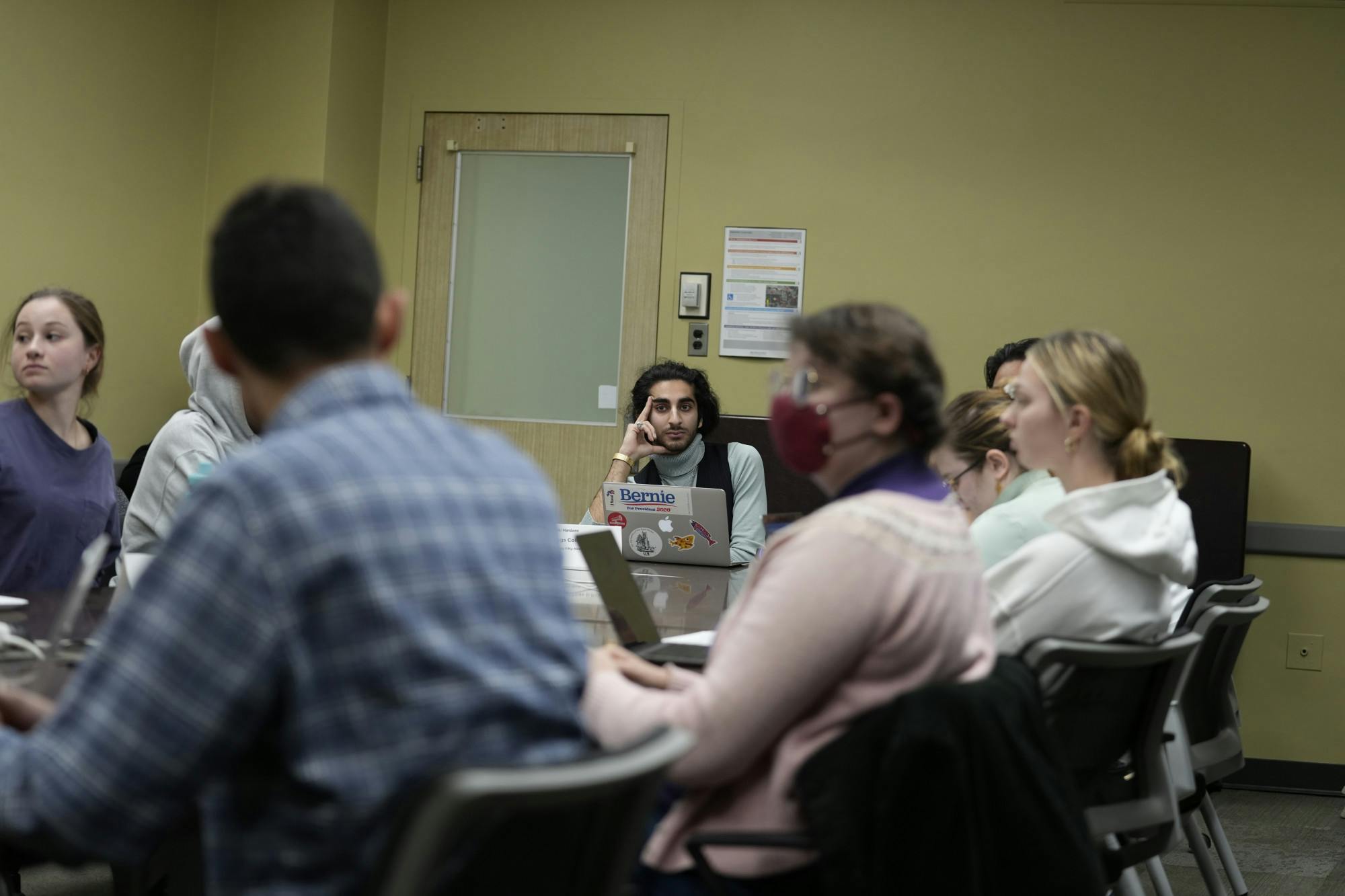 <p>An ASMSU representative listens as colleagues critique his bill at a January 26th, 2023, finance committee meeting.</p>