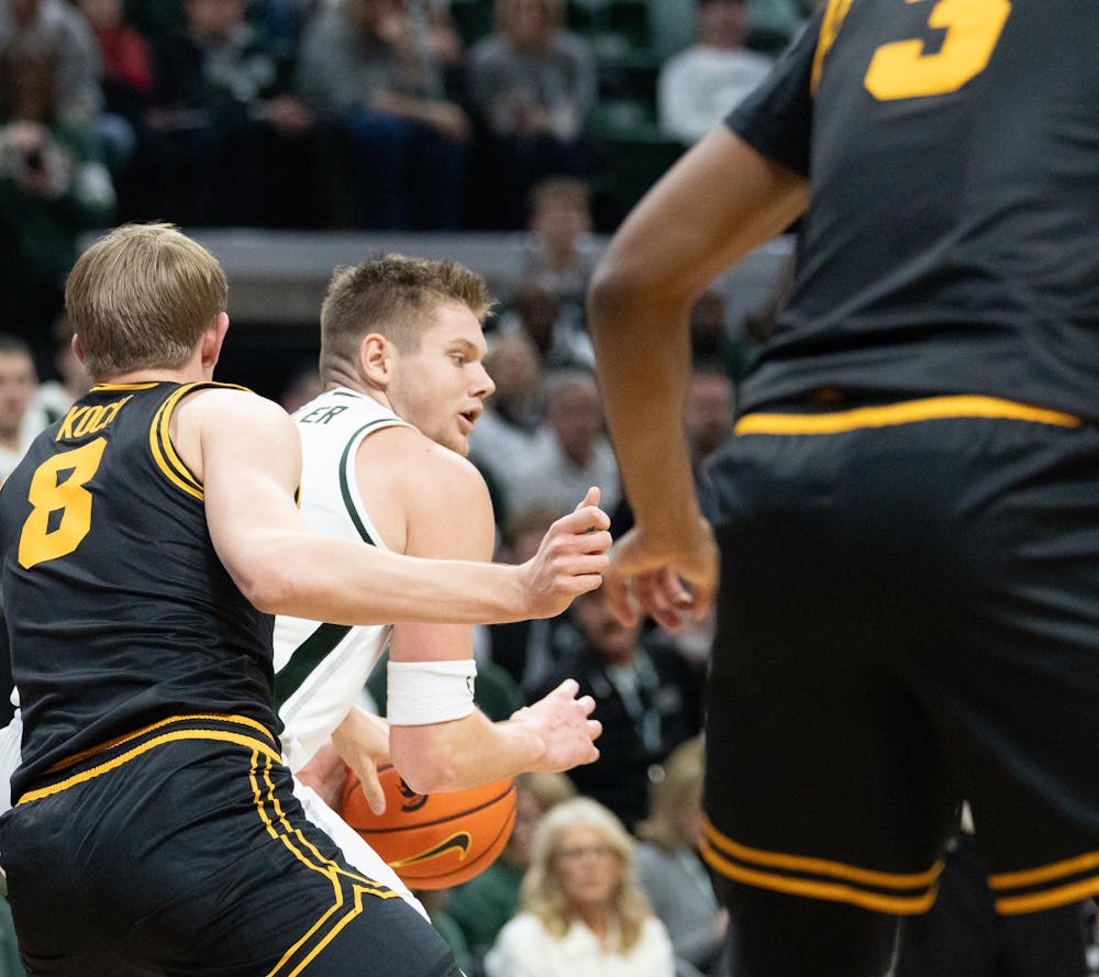 <p>Senior forward Jaxon Kohler (0) secures the ball during the matchup against the University of Iowa at the Breslin Center on Dec. 2, 2025.</p>