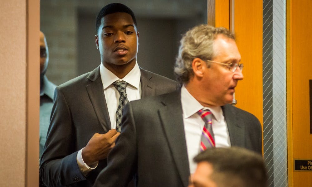 <p>Ex-MSU football player Donnie Corley enters 54-B District Court for his arraignment on June 7, 2017 in East Lansing. Corley is one of three ex-MSU football players facing charges for an alleged rape Jan. 16.</p>
