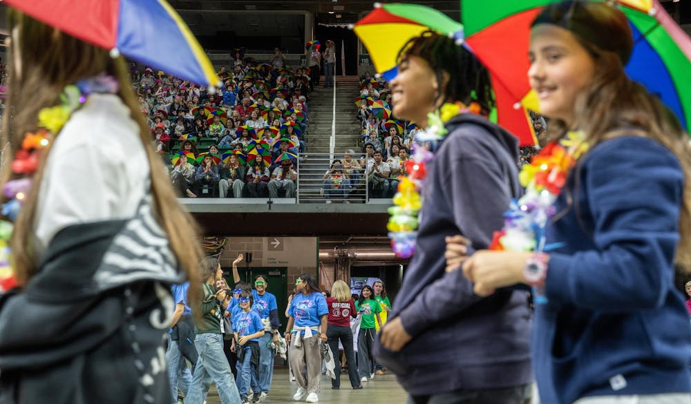 Odyssey of the Minds competitors parade around the Jack Breslin Center in East Lansing, Michigan on May 21, 2025. 