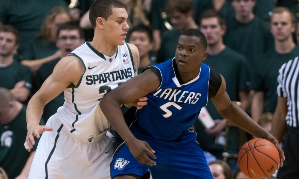 Freshman forward Gavin Schilling guards Grand Valley State forward Trevin Alexander on Oct. 29, 2013, during the game at Breslin Center. MSU defeated the Lakers, 101-52. Julia Nagy/The State News